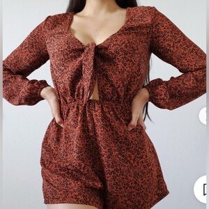 Long sleeved floral brown and black romper